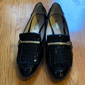 Women’s flat black patent leather shoes